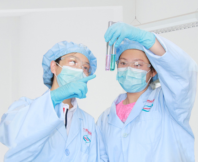 two people examining a test tube